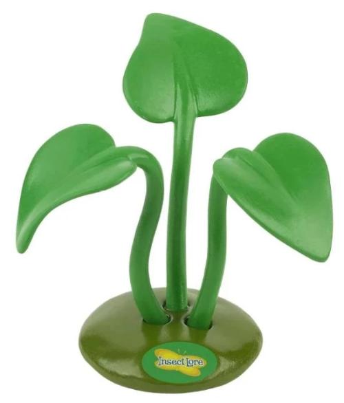 Plastic green 3-pronged stand with green leaves for holding praying mantis egg case.
