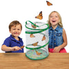 2 children releasing their adult butterflies from their green, cylindrical, pop-up, mesh habitat.