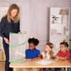 An adult and three children looking into a Butterfly Pavilion butterfly habitat in a home setting.