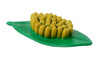 Figurine of dozens of plastic yellow eggs attached to plastic green leaf.