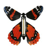Orange, black, and white, butterfly rubber band wind-up toy.